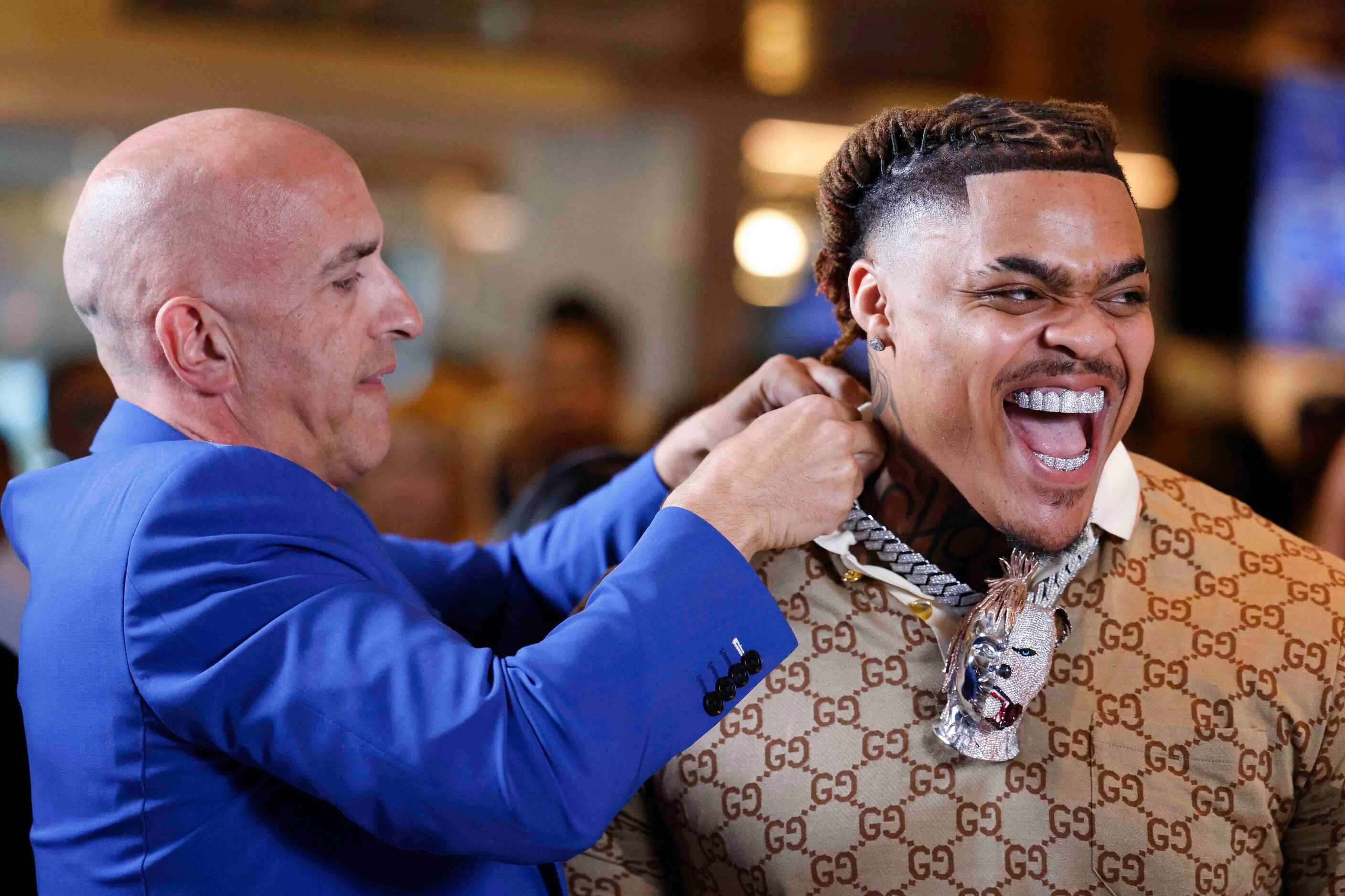Texas Defensive tackle Byron Murphy II from DeSoto, gets his necklace adjusted during a NFL...