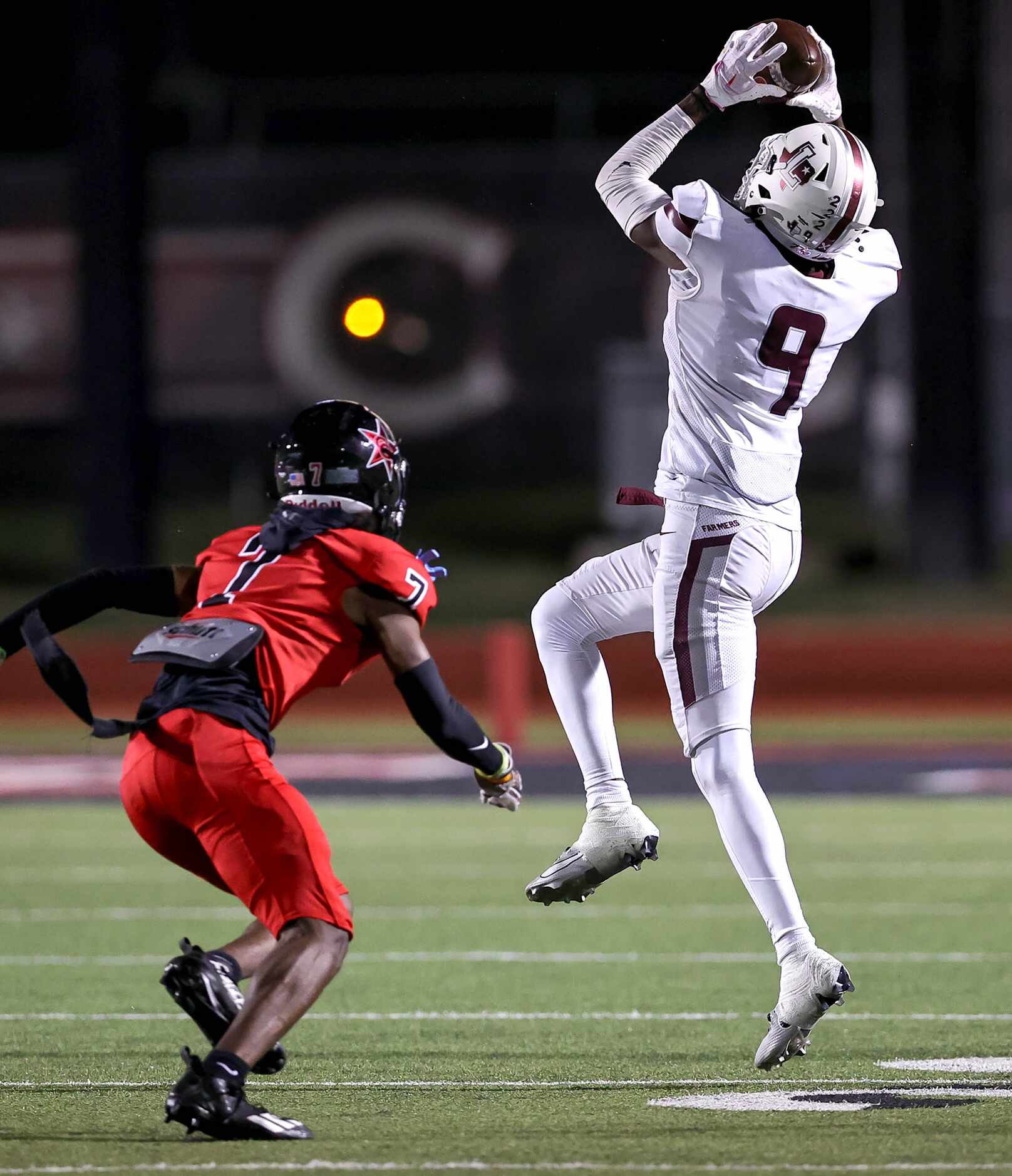 Lewisville wide receiver Lamar Kerby (9) comes up with a reception in front of Coppell...