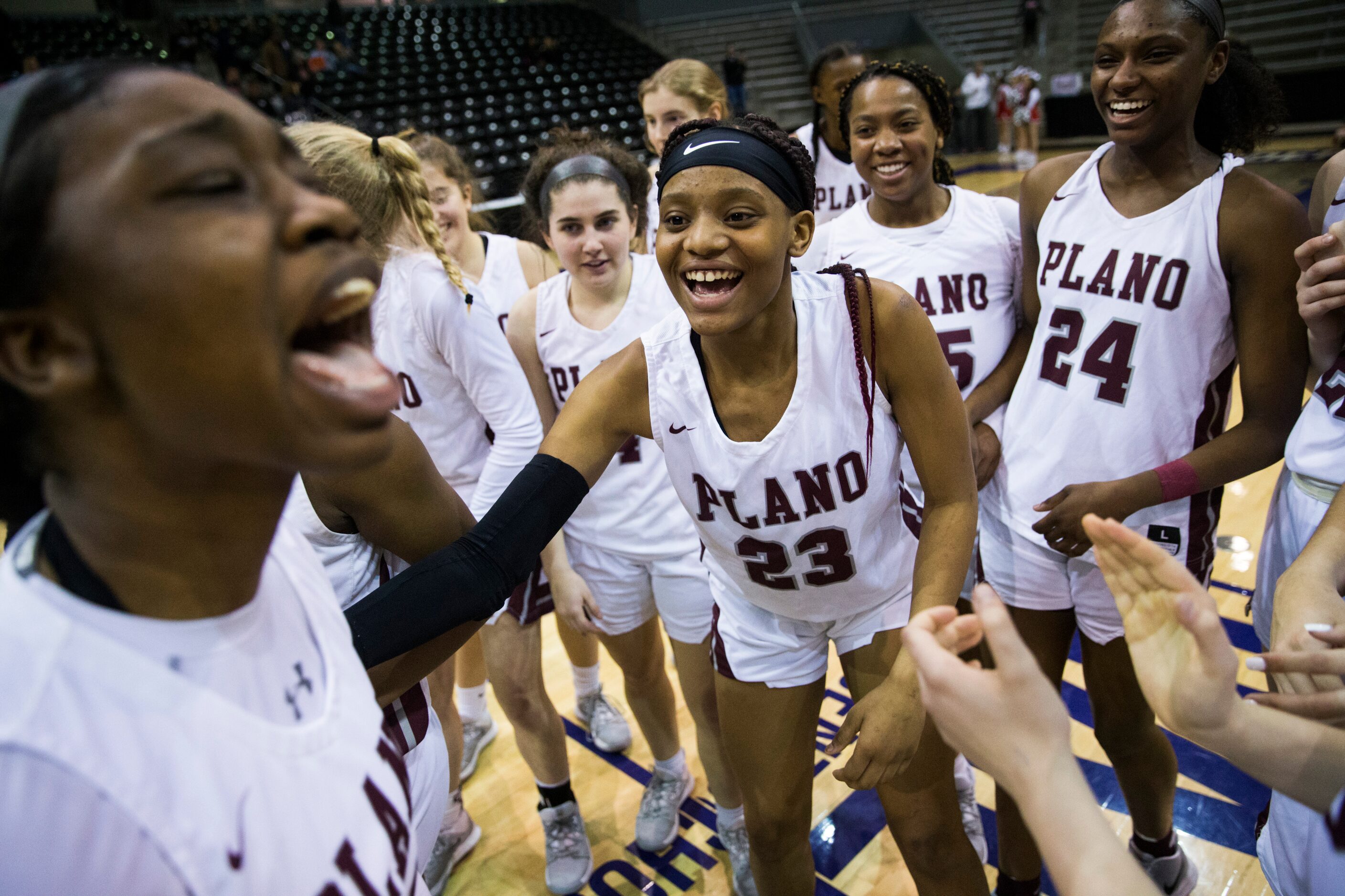 Plano celebrates a 60-46 win after a UIL 6A Region II semifinal girls basketball game...