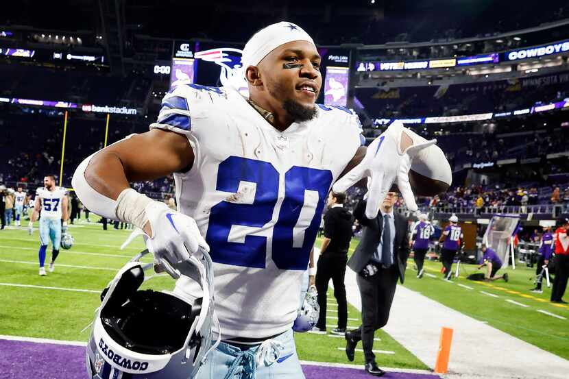 Dallas Cowboys running back Tony Pollard (20) celebrates the teams big win over the...