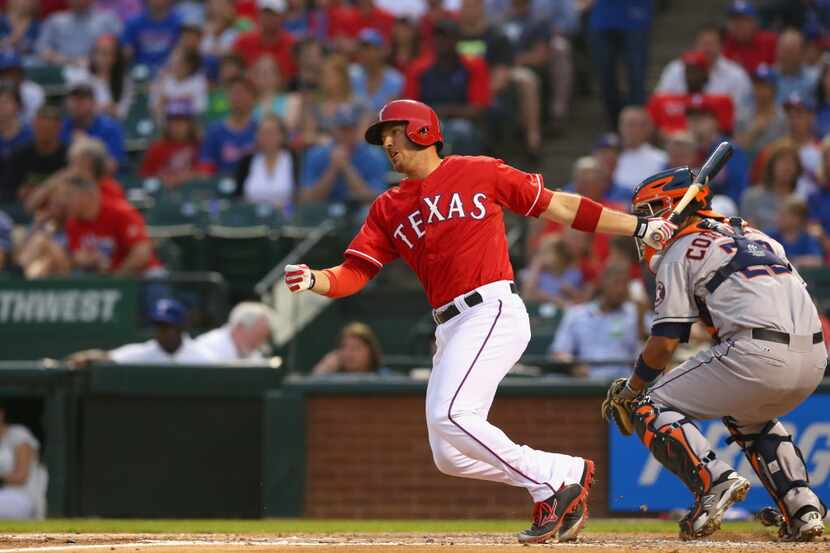 ARLINGTON, TX - APRIL 12:  J.P. Arencibia #7 of the Texas Rangers drives in a run against...