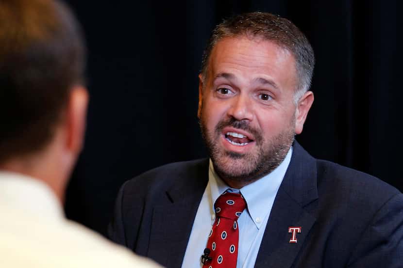 FILE - In this Aug. 4, 2015, file photo, Temple coach Matt Rhule, right, speaks with a...