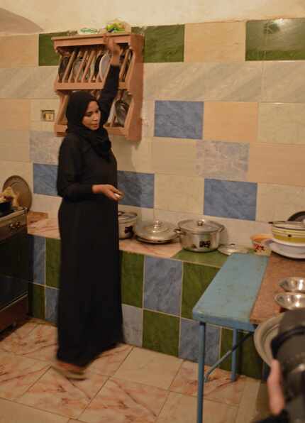 Ashraf Sahloul's wife, Nawal, prepares a meal for a G Adventures tour group. 