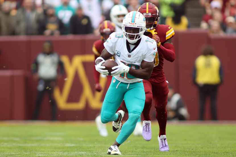 Miami Dolphins wide receiver Tyreek Hill (10) runs during an NFL football game against the...