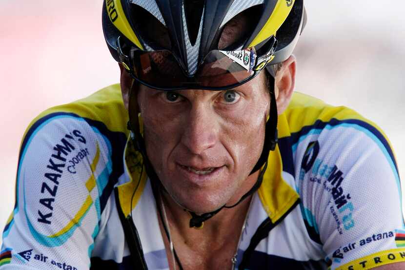 FILE - In this July 19, 2009, file photo, Lance Armstrong crosses the finish line during the...