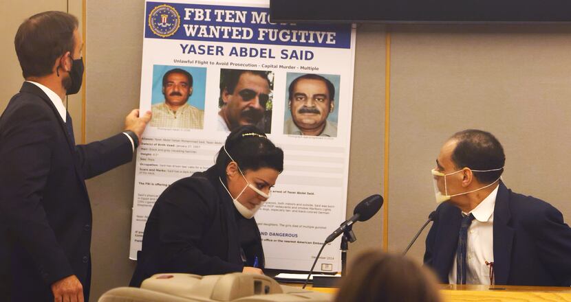 Yaser Said (right), 65, looked at the FBI Ten Most Wanted Fugitive poster with his picture...