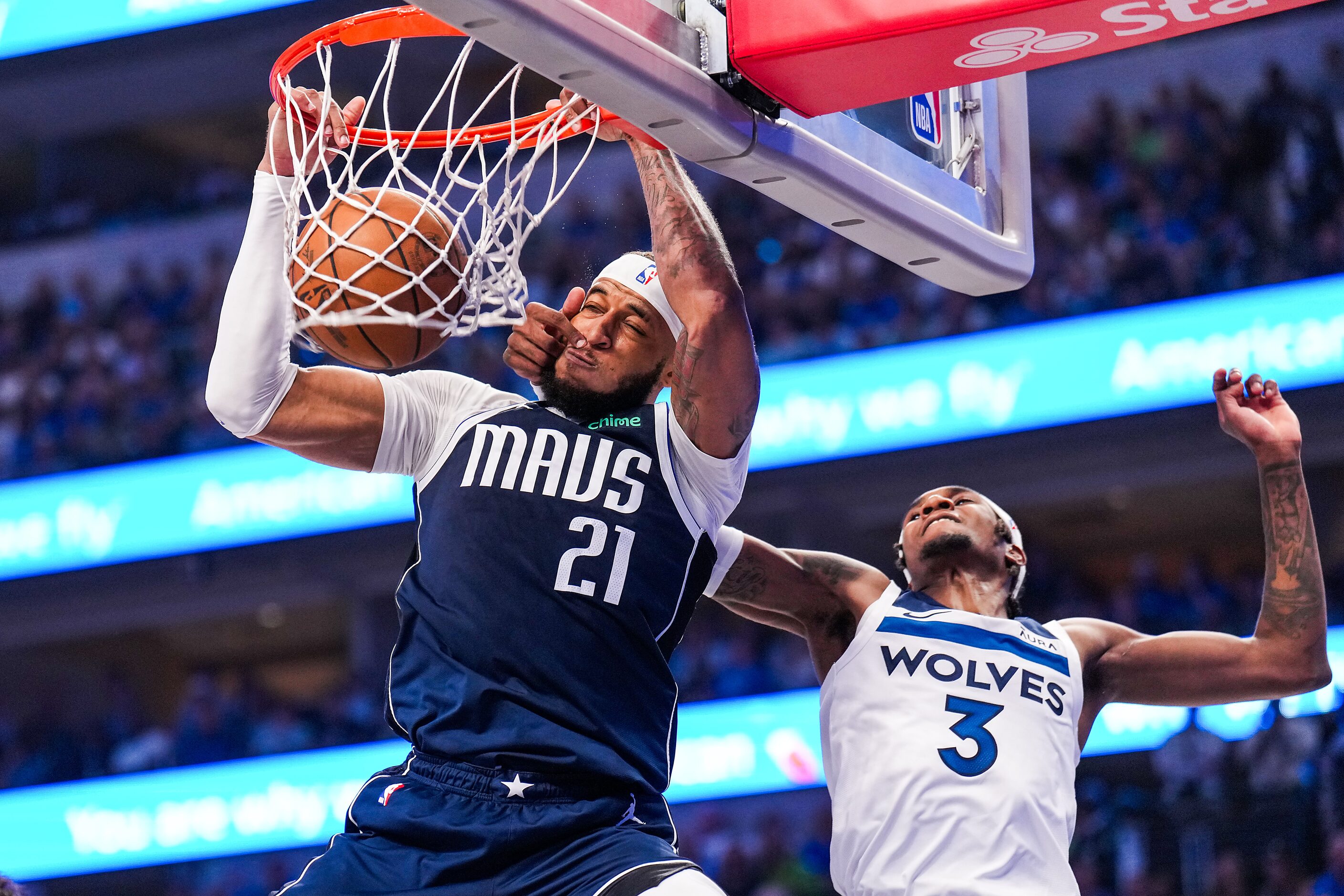 Dallas Mavericks center Daniel Gafford (21) dunks the ball past Minnesota Timberwolves...