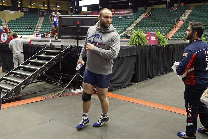Tervel Dlagnev of the USA wrestling team, waits for the match prior to his to finish on...