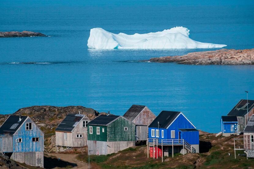 Icebergs float behind the town of Kulusuk in Greenland. President Donald Trump's interest in...