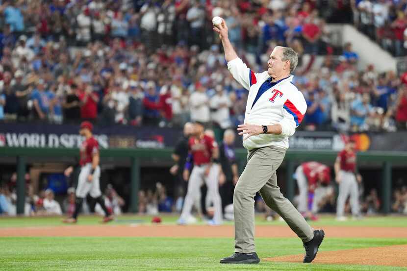 Former President George W. Bush throws the ceremonial pitch to former Texas Rangers catcher...