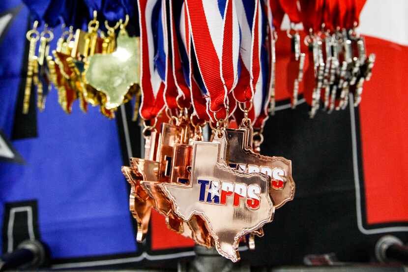 TAPPS swim meet medals during the TAPPS Division I state swim meet at the Mansfield ISD...