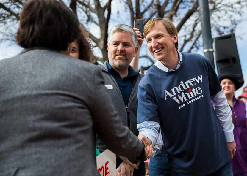 Gubernatorial candidate Andrew White, right, who is the son of former Texas Gov. Mark White,...