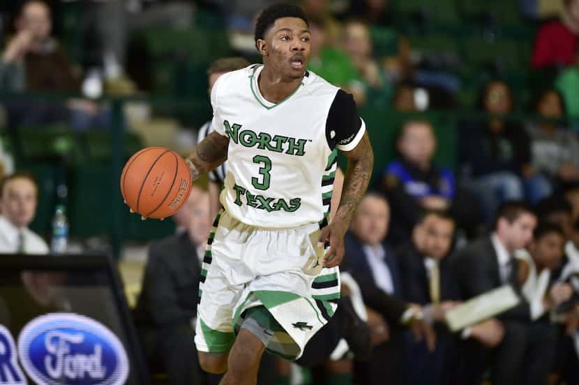 North Texas sophomore guard DeAndre Harris (3) brings the ball up court against Charlotte,...