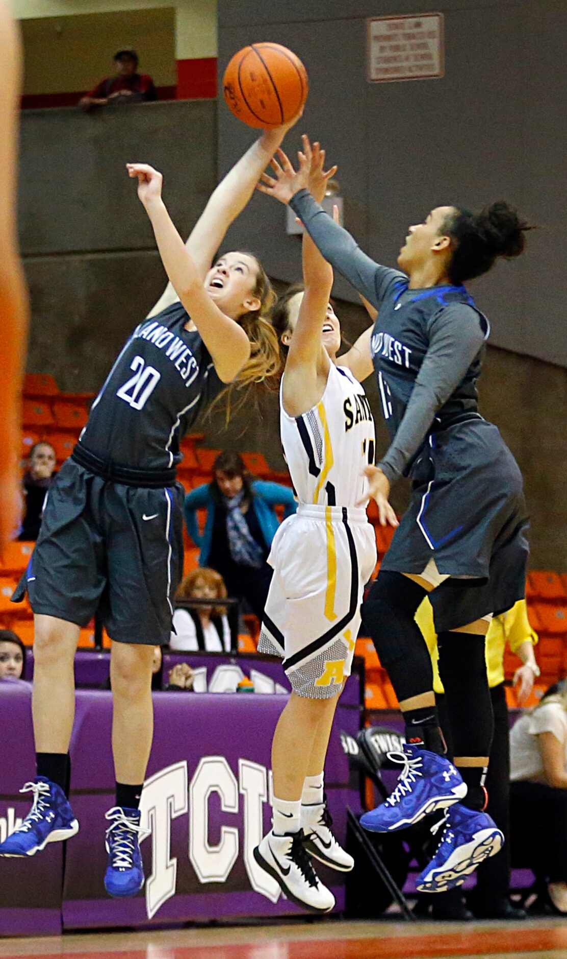 Plano West Daria Cosgrove (20) and Callie Owens (13) steal a loose ball from Amarillo wing...