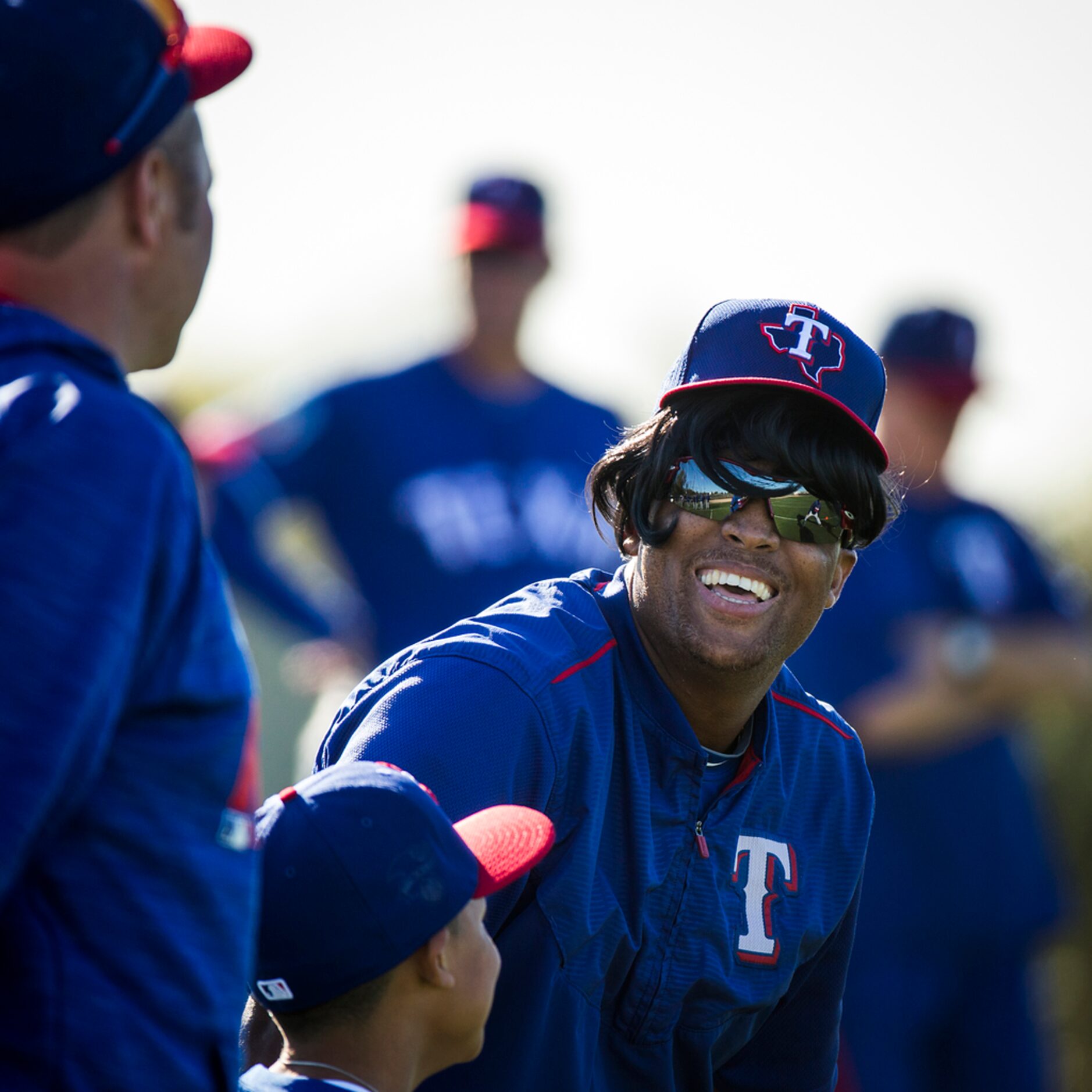 Texas Rangers third baseman Adrian Beltre as he stretches during a spring training workout...