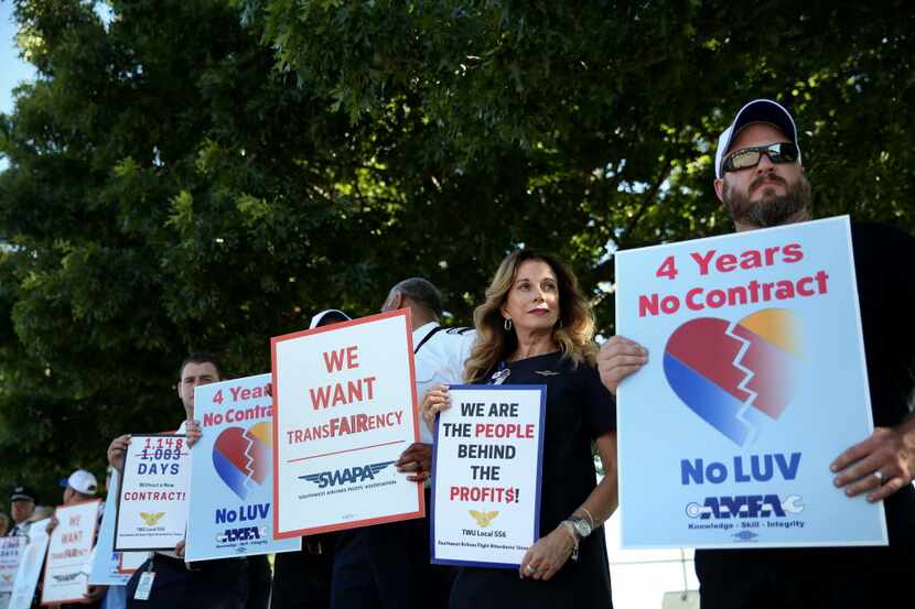 Members of Southwest Airlines' mechanics, flight attendants and pilots unions picketed last...