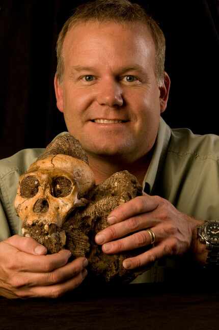 Wits University's Rising Star Expedition leader, Lee Berger, holds the fossil of an...