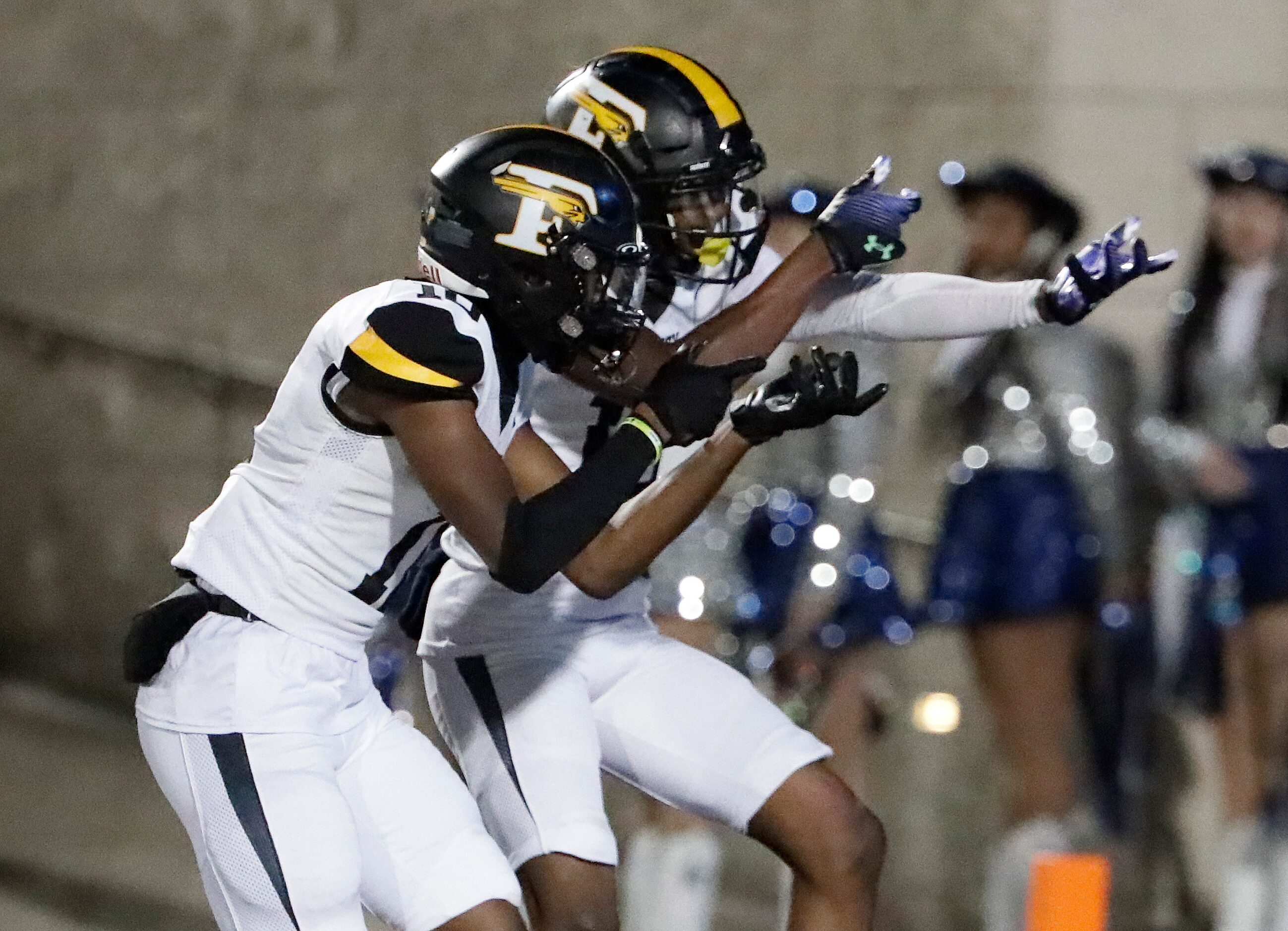 Forney High School wide receiver Kofi Eduful (10) and Forney High School wide receiver Imari...