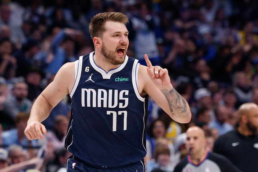 Dallas Mavericks guard Luka Doncic (77) reacts during the first half of an NBA game against...