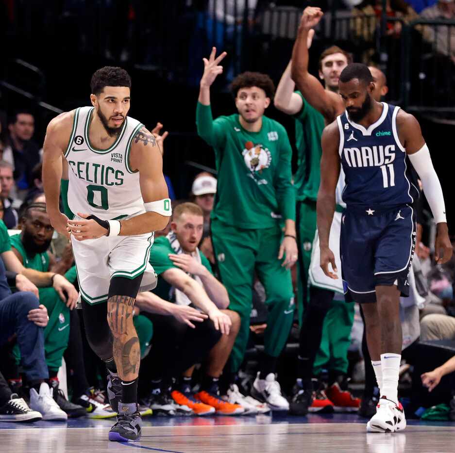 Boston Celtics forward Jayson Tatum (0) runs back down court after hitting a late second...