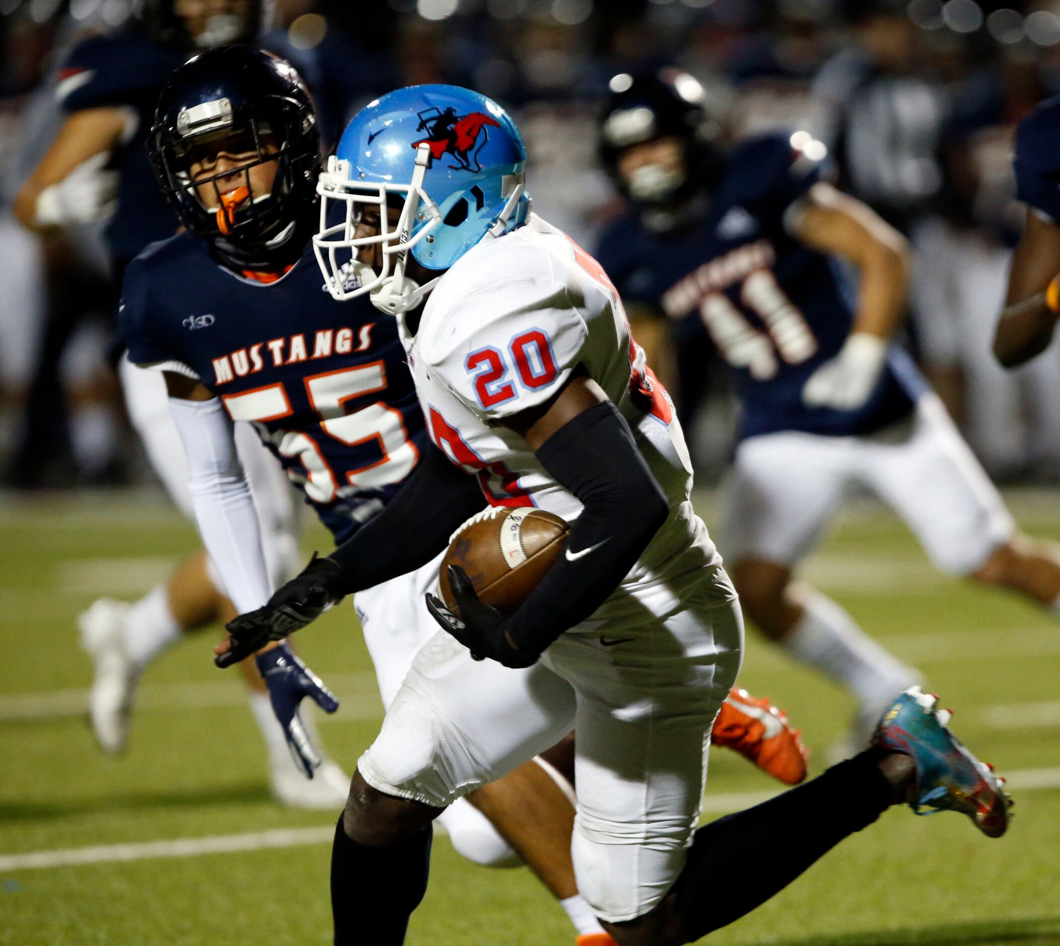 Skyline’s Gregory Johnson (20) gets a first down, as he chased by Sachse defender Jacob...