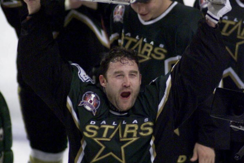 ORG XMIT: S11A11245 Dallas Stars goalie Ed [ Eddie ] Belfour holds the Stanley Cup after...