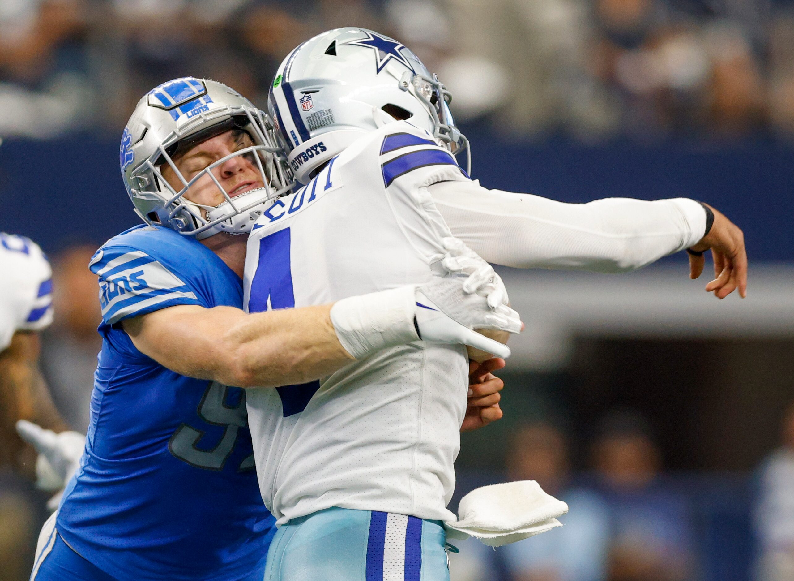 Detroit Lions defensive end Aidan Hutchinson (97) hits Dallas Cowboys quarterback Dak...