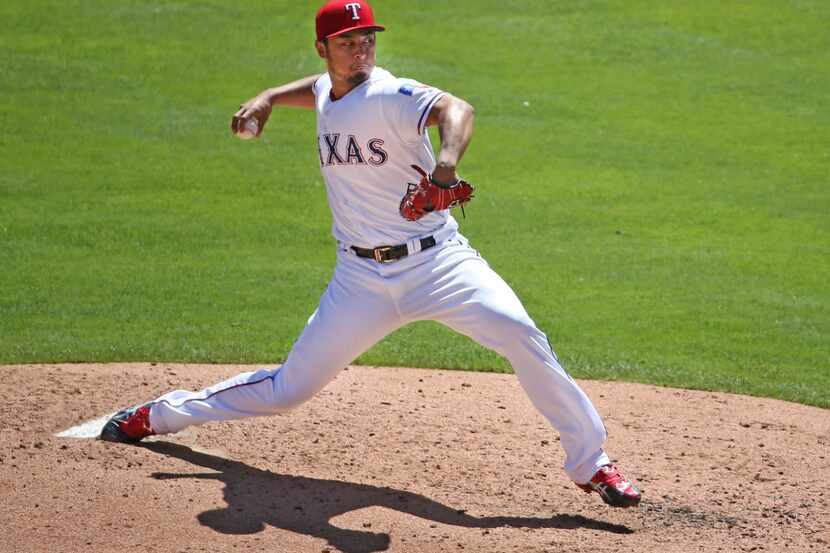 Texas Rangers starting pitcher Yu Darvish (11) throws a third-inning pitch during the Kansas...