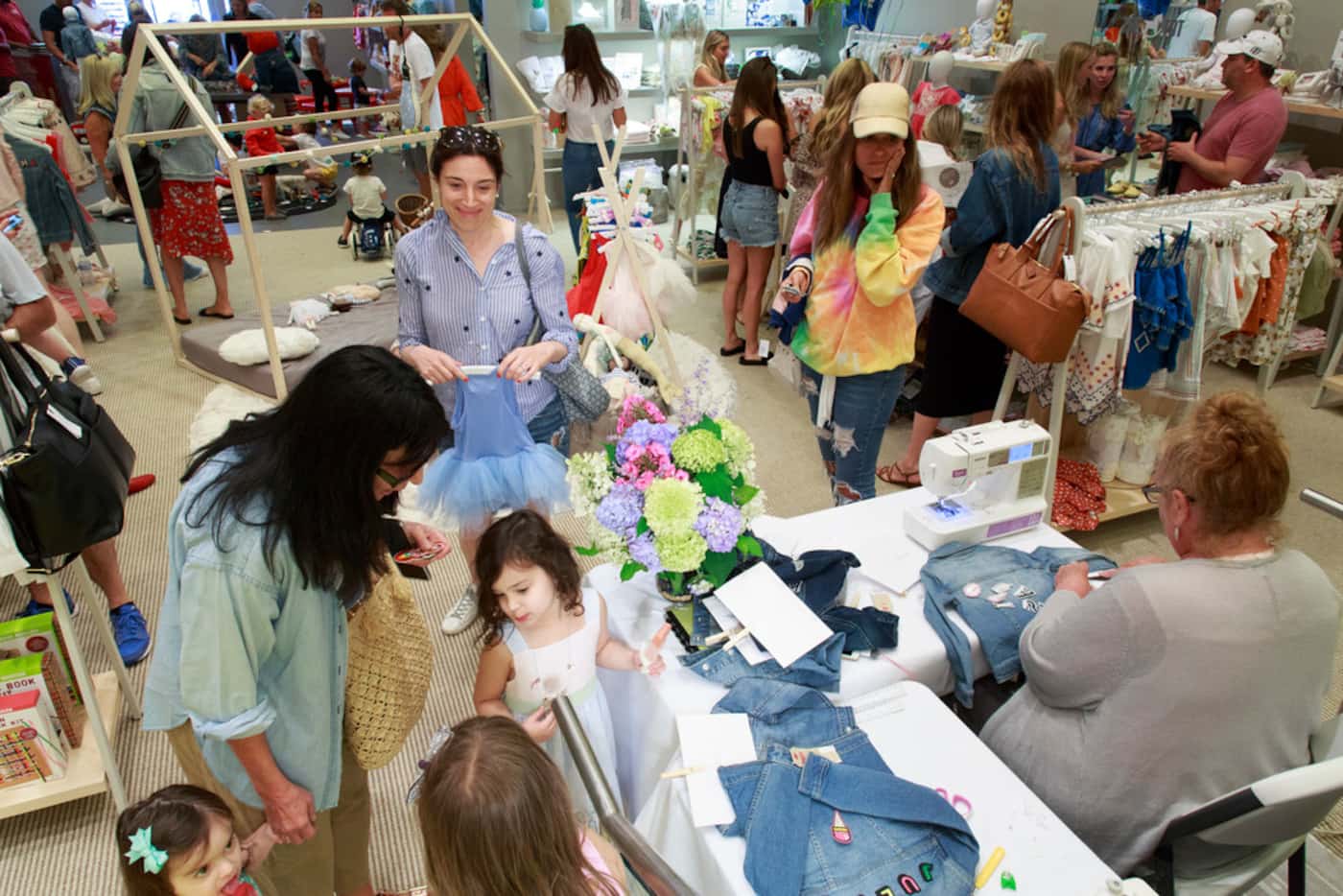 A mommy and me event to embellish Levis blue jean jackets at The Tot's pop-up shop in The...