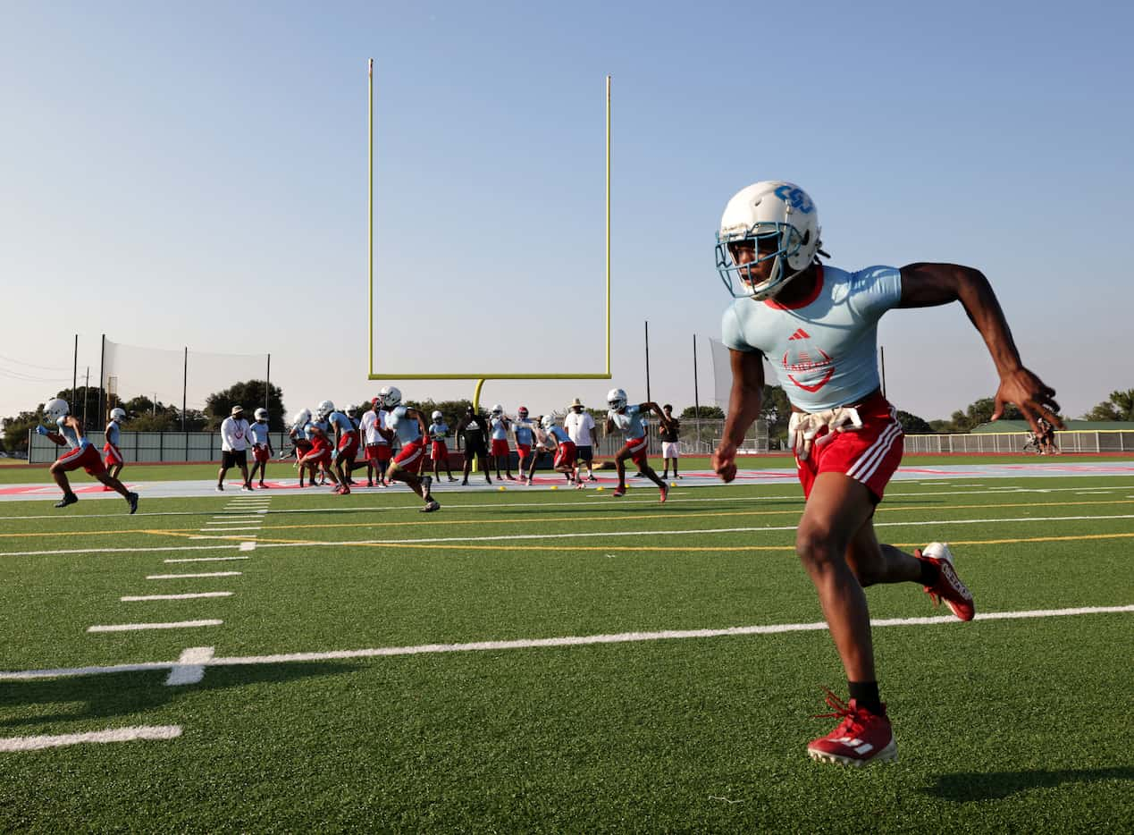 Players attend their first day of football practice at Carter High School in Dallas, TX, on...