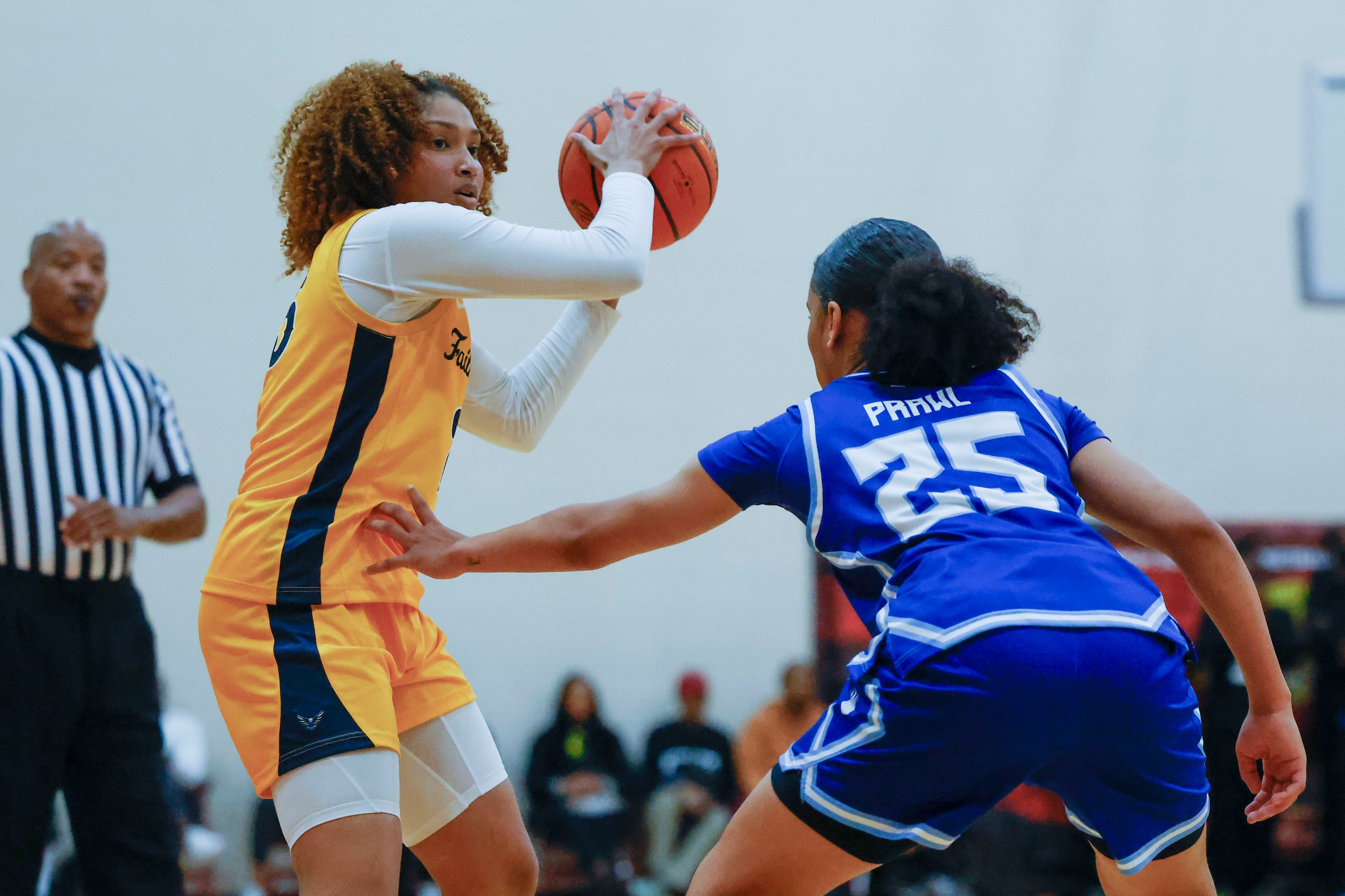 Oak Cliff Faith Family Academy’s Amayah Garcia (left) keeps the ball away from IMG Academy’s...