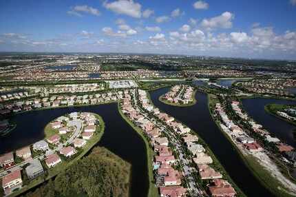 An aerial view of housing developments near the northern part of the Everglades in Palm...