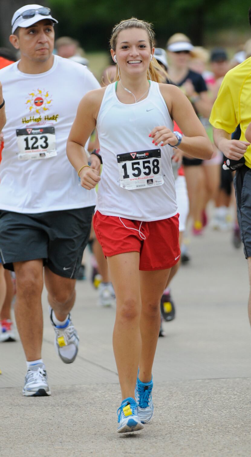 Emily Mullins smiles as she begins the Hottest Half at Norbuck Park on Sunday, August 12,...