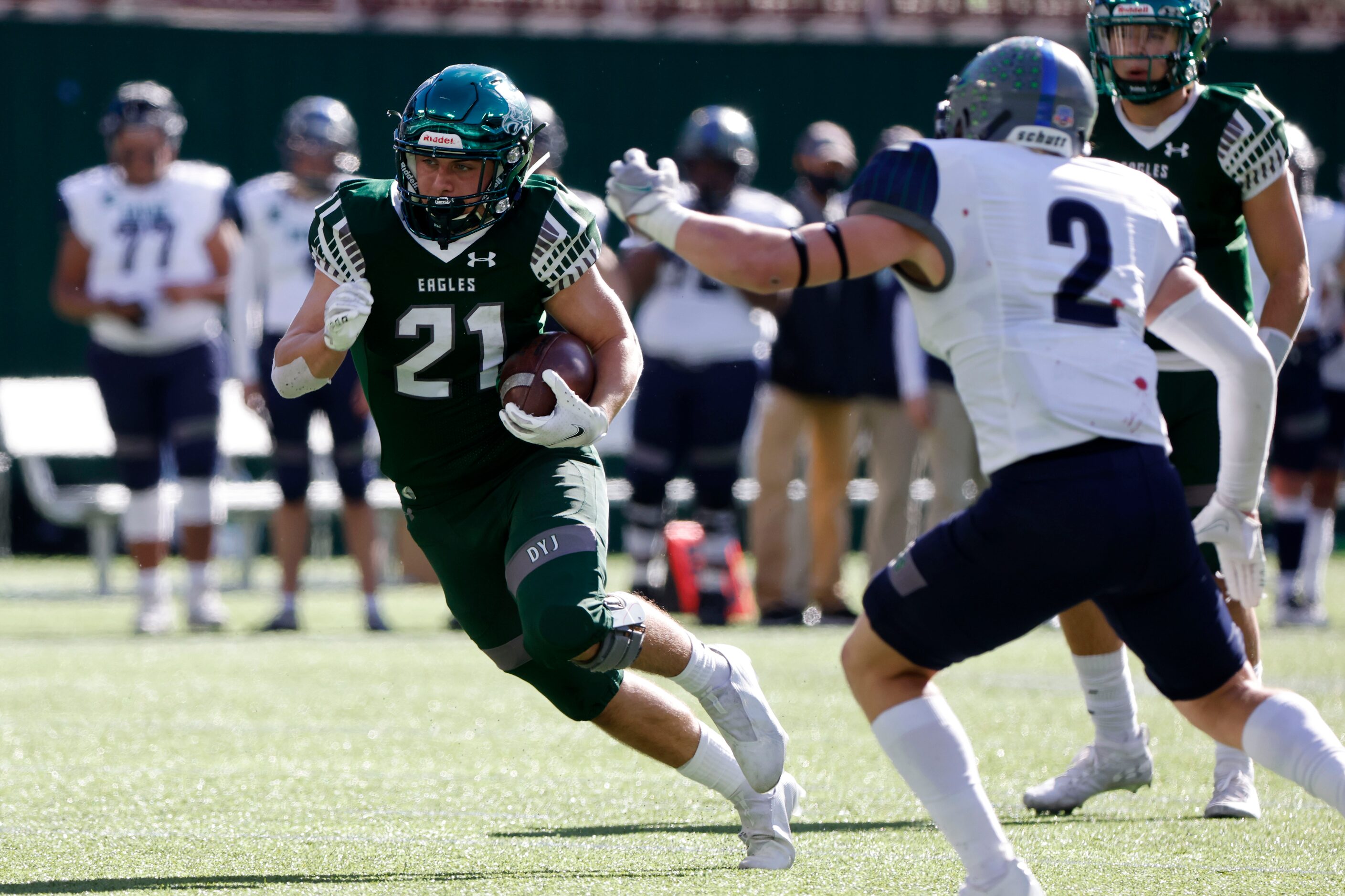 Prosper running back Jacob Devenny (21) tries to get past Northwest Eaton player Seth...