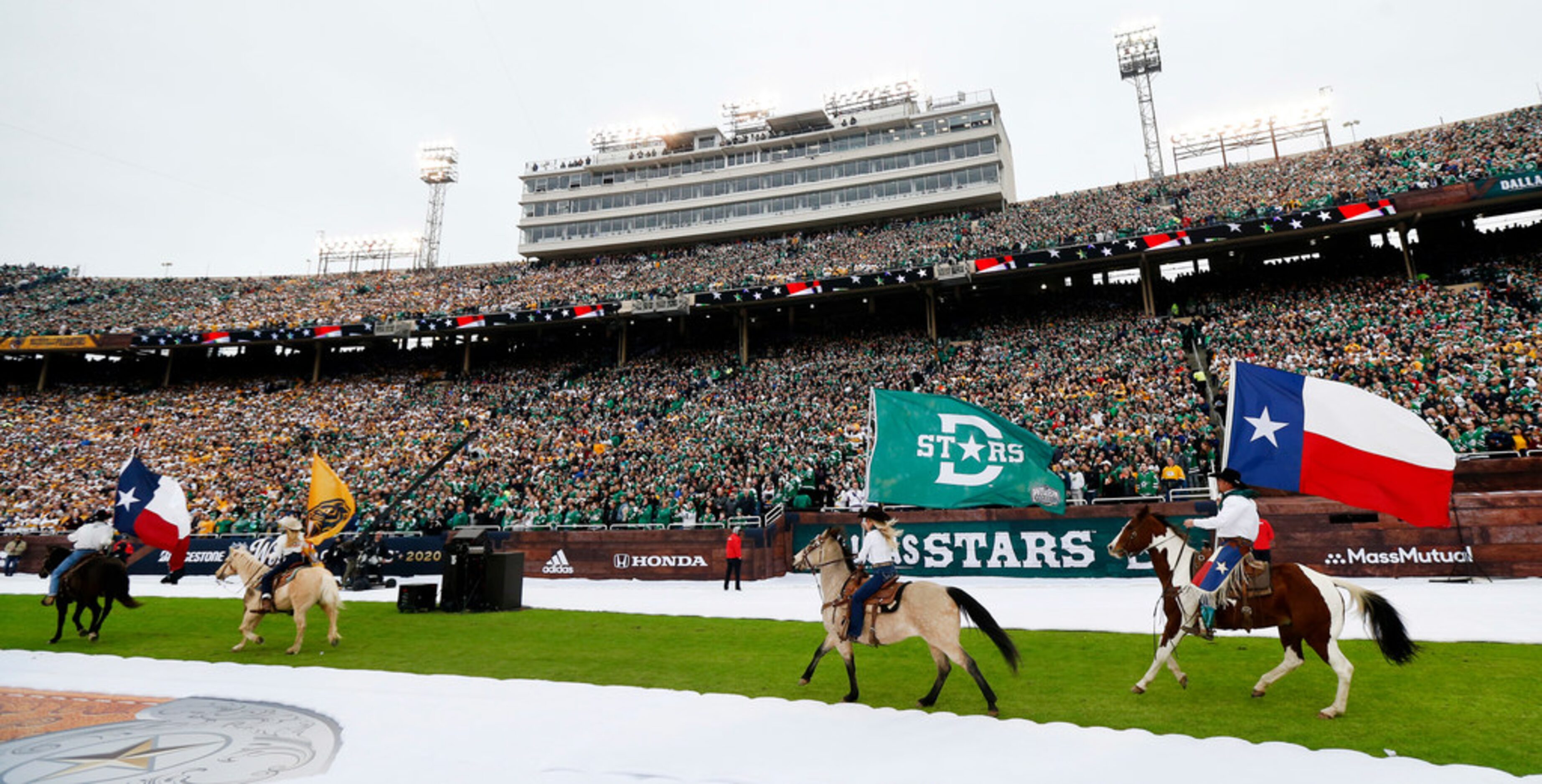 Riders on horseback carried Dallas Stars Nashville Predators flags alongside the State of...