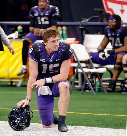 TCU Horned Frogs quarterback Max Duggan (15) takes a knee on the sideline after losing to...