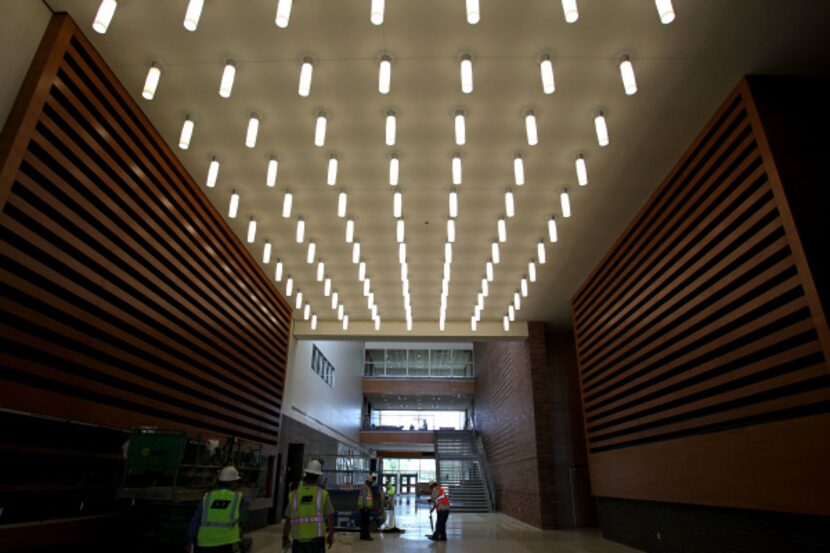 The main hall at the new high school will soon be packed with students: The first bell rings...