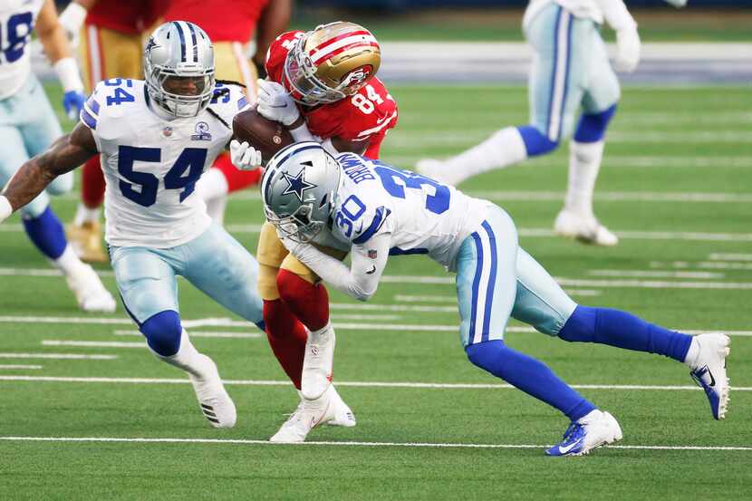 Dallas Cowboys cornerback Anthony Brown (30) hits San Francisco 49ers wide receiver Kendrick...
