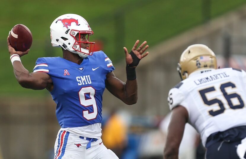 Southern Methodist quarterback William Brown (9) fires off a pass over Navy linebacker...