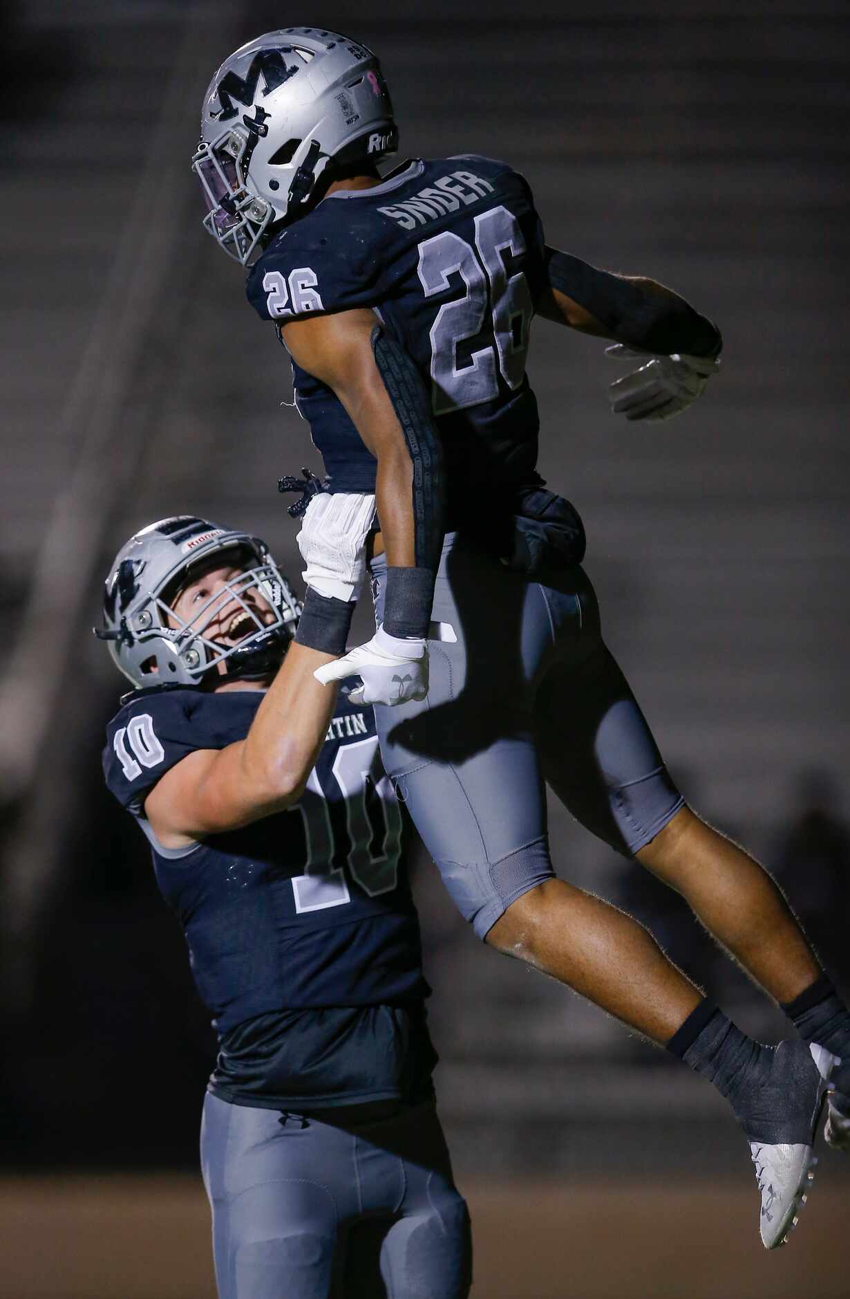 Arlington Martin junior running back Sergio Snider (26) is congratulated by senior tight end...