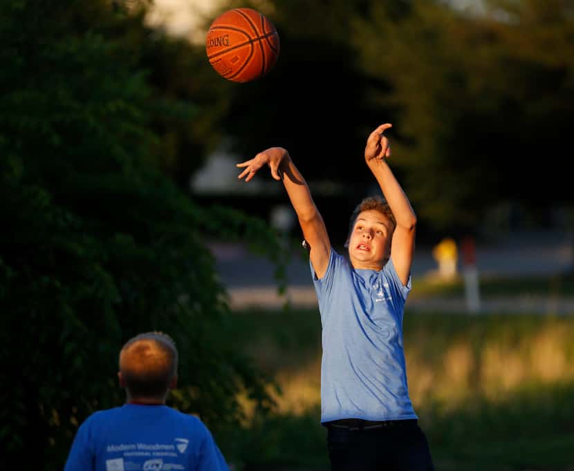 Brian Ellis shoots during a pickup basketball game during the Life is Sweet Carnival at...