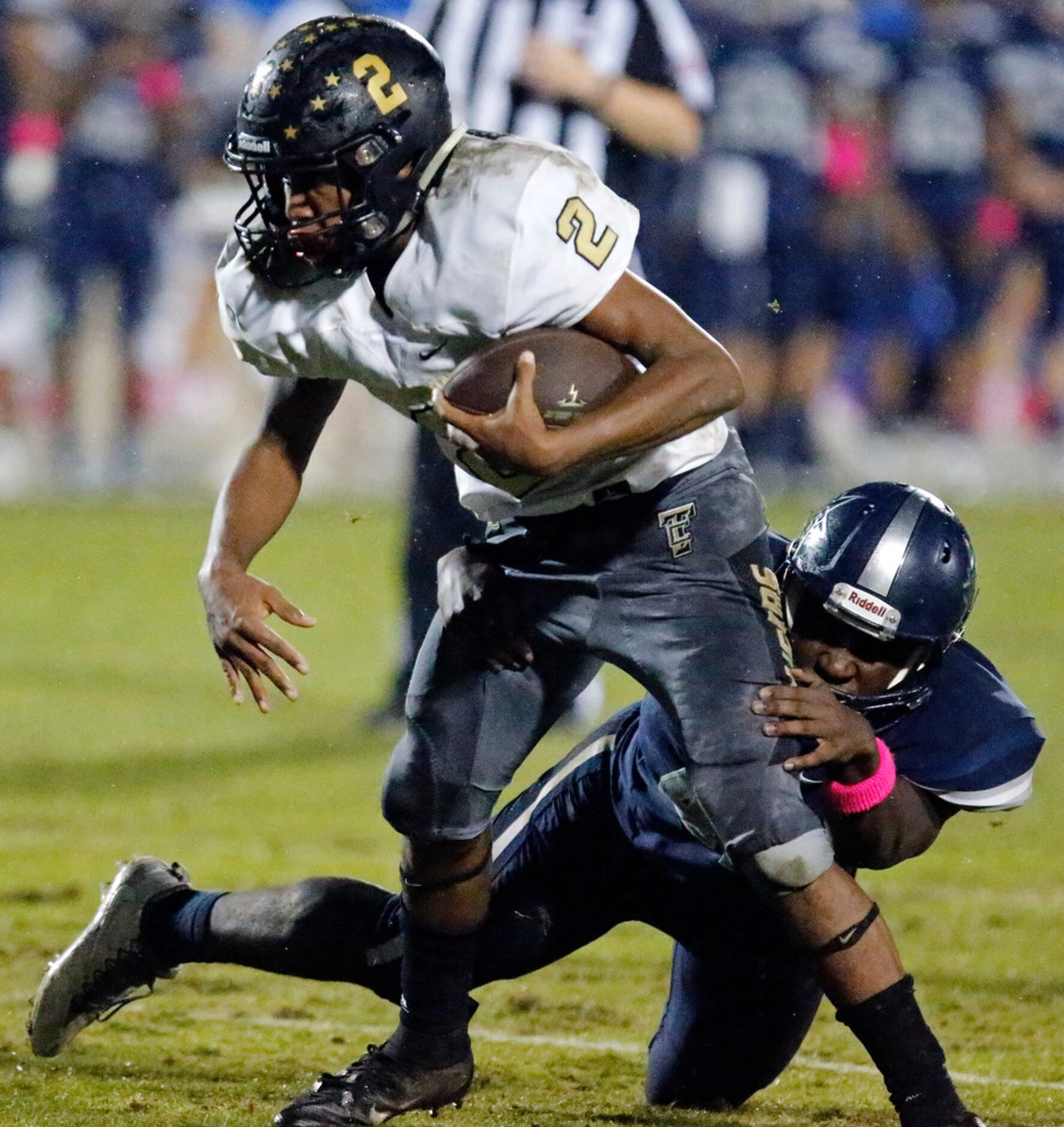 The Colony High School running back Myles Price (2) broke this tackle attempt by Lone Star...