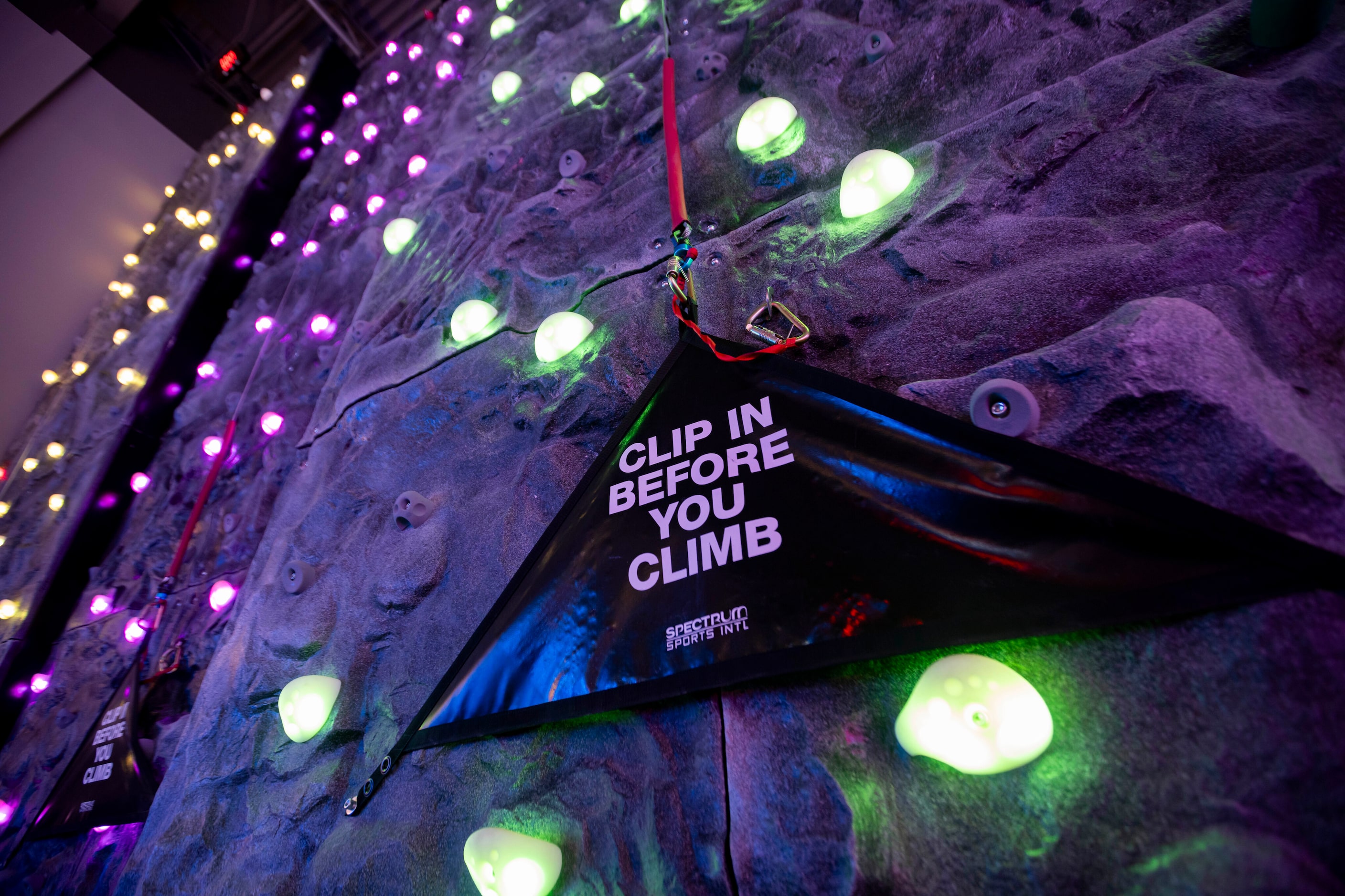 A climbing wall at Outtakes Arcade inside of B&B Theatres, a new entertainment facility...