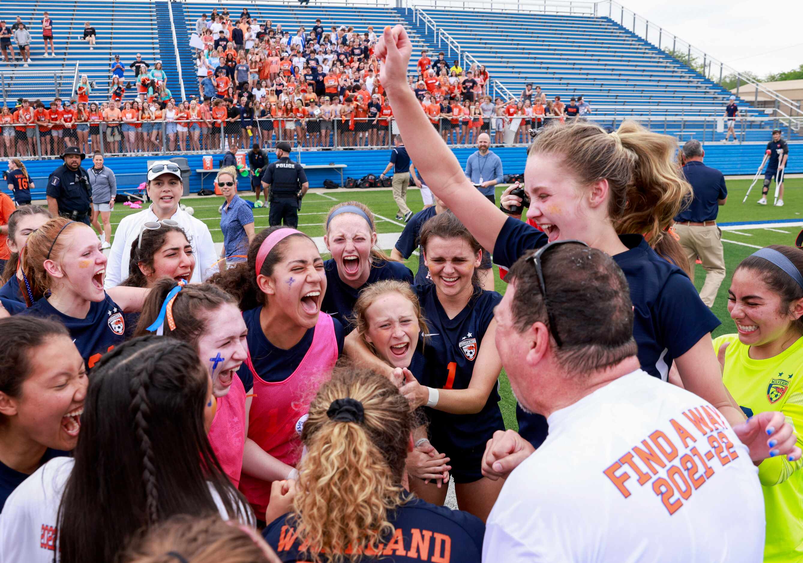 Frisco Wakeland players celebrate with Frisco Wakeland head coach Jimmie Lankford after...