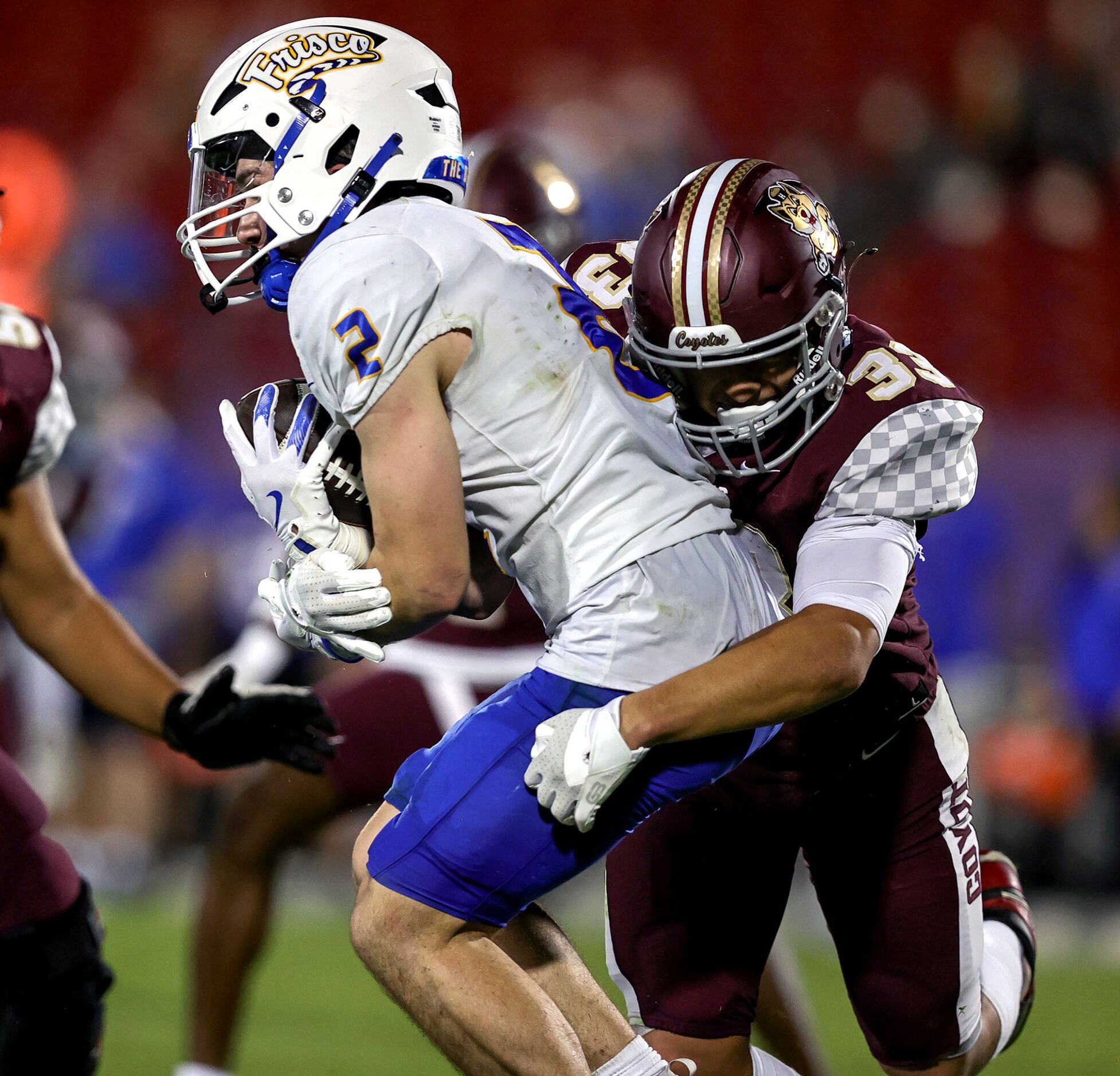 Frisco wide receiver Jackson Voris (2) is brought down for a loss by Frisco Heritage...