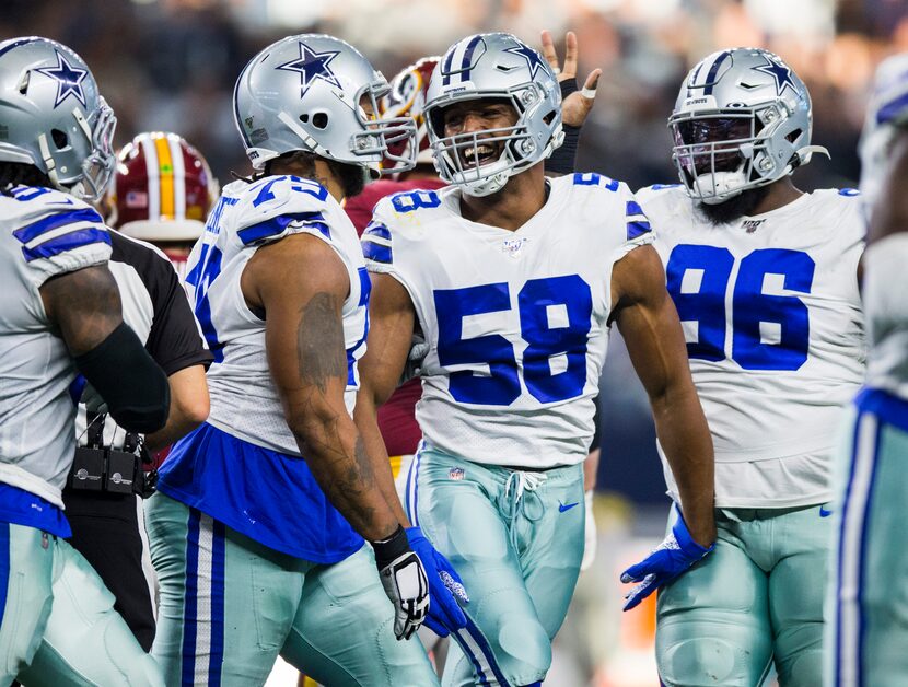 Dallas Cowboys defensive end Robert Quinn (58) celebrates after sacking Washington Redskins...