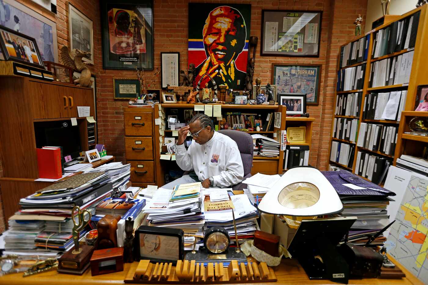 Commissioner John Wiley Price works in his office in June 2016. He says he reads every...