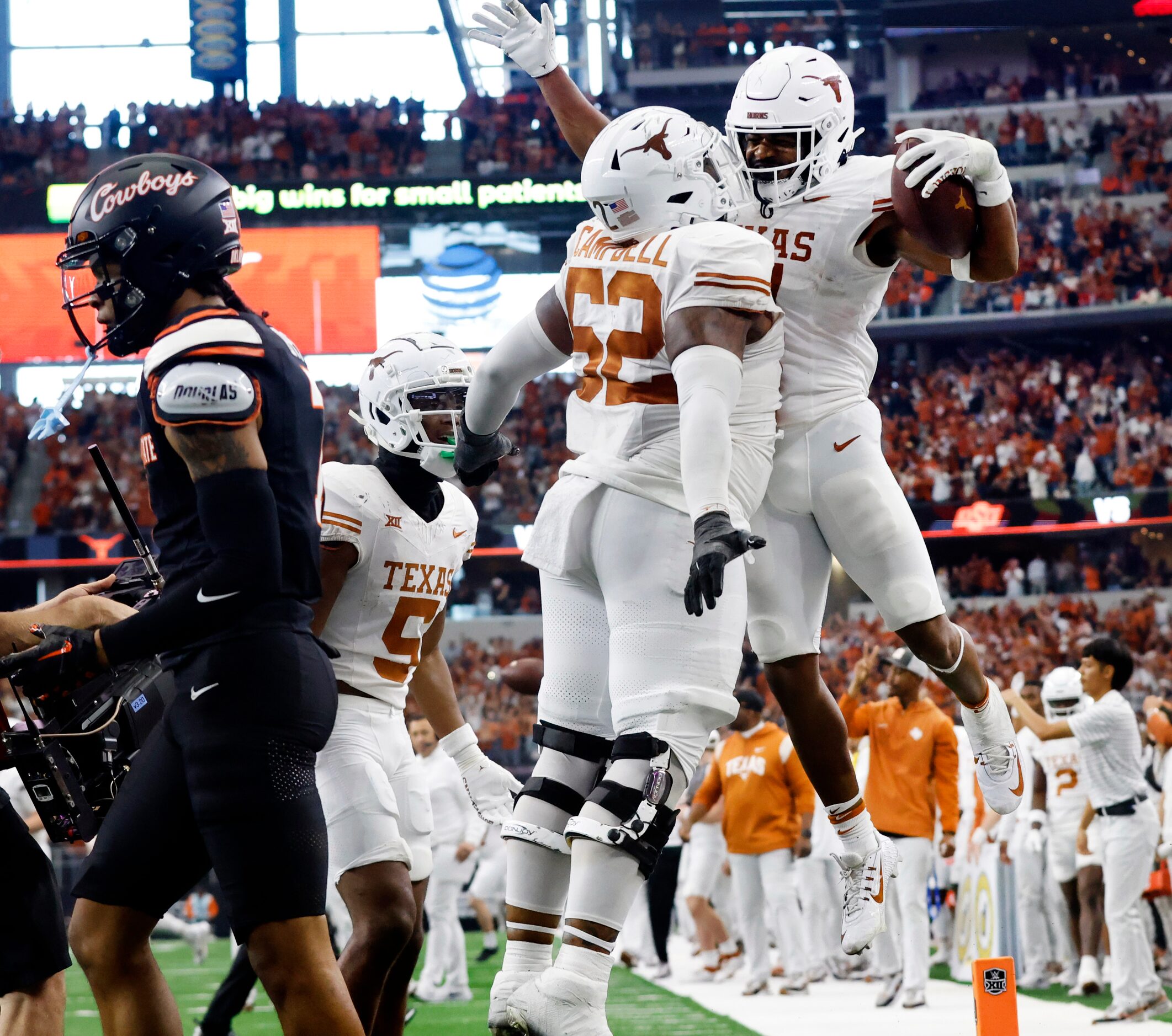 Texas Longhorns running back Keilan Robinson (7) is congratulated on his fourth quarter...