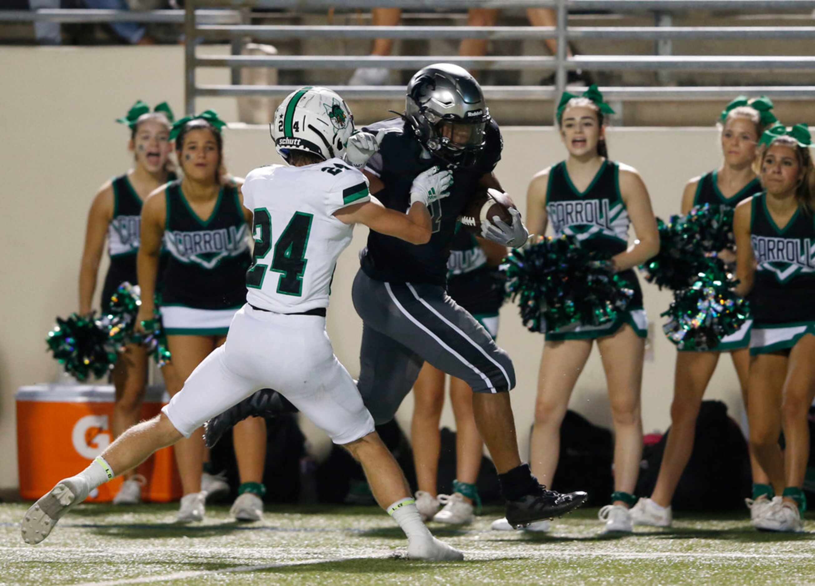 Denton Guyer's Kaedric Cobb (1) is pushed out of bounds by Southlake Carroll's Josh Sweat...