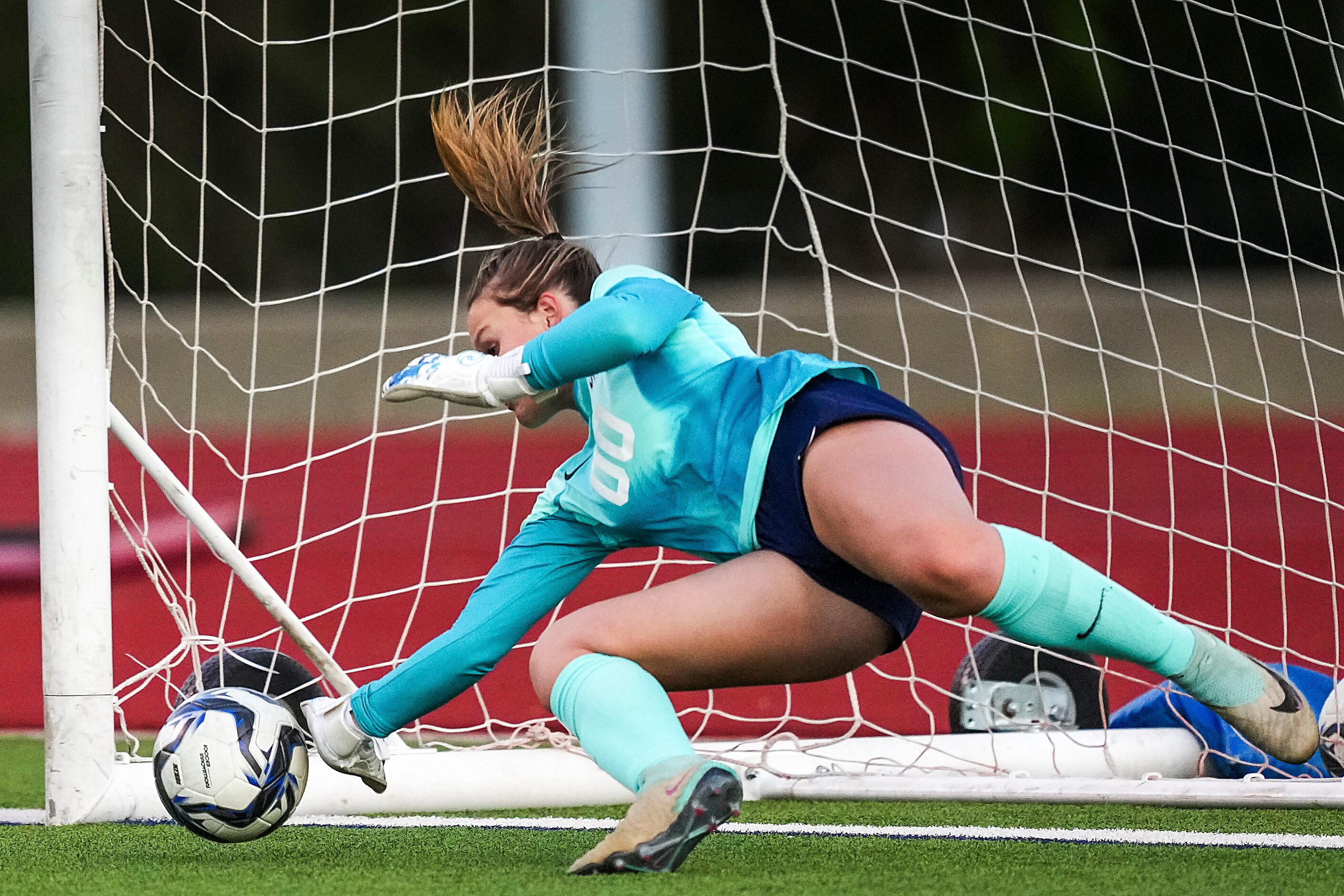 Prosper Walnut Grove goalkeeper Finley Pike keeps her team in the game with a save on a...